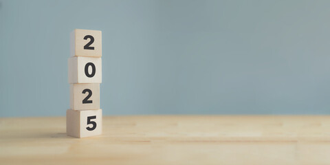 Starting new year 2025. 2025 on wooden cube blocks. Beginning and start of the new year 2025....