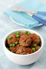 Meatballs with peas.