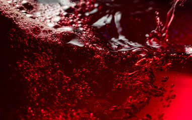 Red wine abstract splashing in glass.