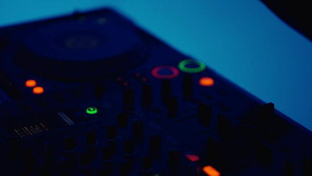 Flashing Lights On Modern DJ Mixer In Nightclub, Closeup, Woman DJ Playing Music And Mixing Tracks