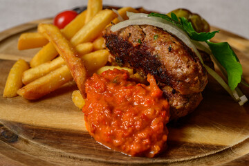 Cevapcici Balkan Style Meatballs with Ajvar Sauce, Onions, Parsley, French Fries and Grilled Pepper - obrazy, fototapety, plakaty