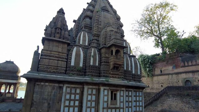 Maheshwar, Madhya Pradesh, INDIA - February 24, 2024, Exterior View of the scenic tourist landmark Maheshwar fort (Ahilya Fort) and temple. This monument is on the banks of the Narmada River.