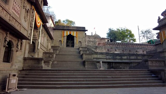 Maheshwar, Madhya Pradesh, INDIA - February 24, 2024, Exterior View of the scenic tourist landmark Maheshwar fort (Ahilya Fort) and temple. This monument is on the banks of the Narmada River.