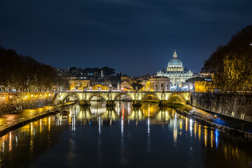 View across the Tiber to St. Peter's Basilica from the Angel Bridge in Rome Lazio Italy - obrazy, fototapety, plakaty