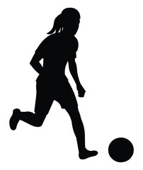 Teenager girl silhouette playing women's football running with the ball on the field during a training session or a junior competition