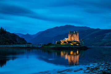 Eilean Donan Castle during blue hour after sunset. Eilean Donan is recognised as one of the most...
