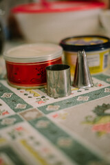 Eid cake molding tools consisting of syringe cakes and shy princesses with butter background.