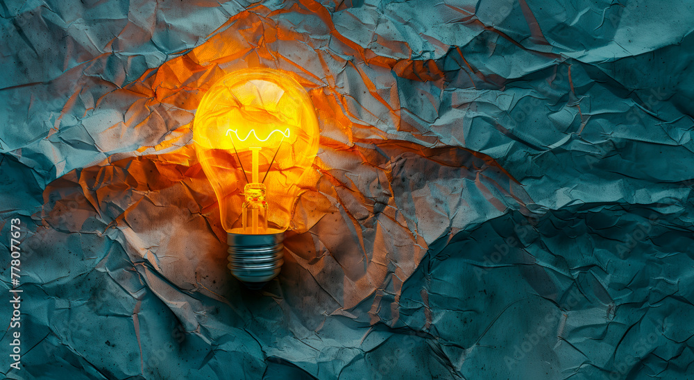 Poster a glowing lightbulb against a crumpled paper background, illustrating the concept of a bright idea. 