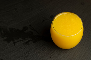 orange juice in a glass cup close-up © rsooll