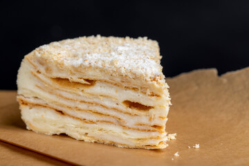 multi-layered cake made of buttercream and thin wheat cakes