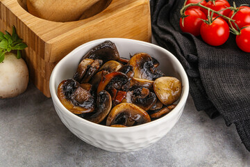 Roasted champignon mushrooms in the bowl