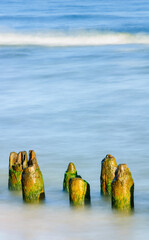 Seascape. Breakwater in the sun. Leba. Baltic Sea. Poland.