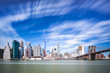 Amazing panorama view of New York City skyline and Brooklyn bridge with skyscrapers and East River 