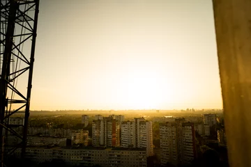 Gordijnen view of the city from above. Sunset in the city. Kyiv from above. View of Kyiv from above © Виталий Маслов