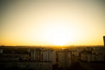 Gordijnen view of the city from above. Sunset in the city. Kyiv from above. View of Kyiv from above © Виталий Маслов