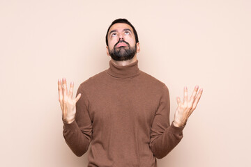 Man over isolated background frustrated by a bad situation