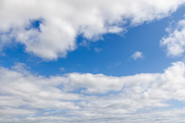 Beautiful sky, where fluffy clouds scatter across the endless blue, creating a perfect backdrop for...