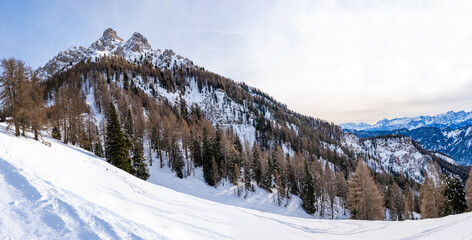 Wide panoramic view of winter landscape with snow covered Dolomites in Kronplatz, Italy