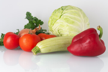 vegetables for salad or soup: tomato, cabbage, zucchini, sweet pepper, onion and herbs