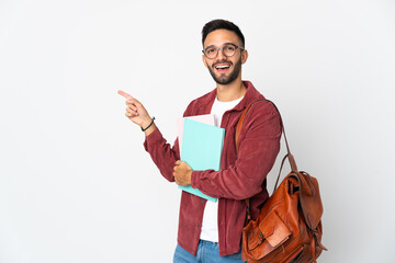 Young student man isolated on white background pointing finger to the side