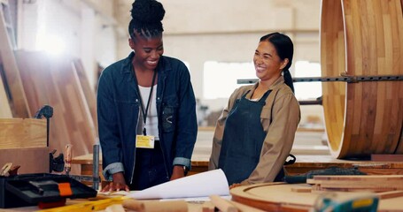 Wood, women and team or celebration in workshop for design blueprint, fist bump or small business remodeling. People, carpenter or contractor with laughing for building development success or victory - Powered by Adobe