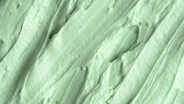 Texture of green clay mask. Swatch of clay mask, rotation