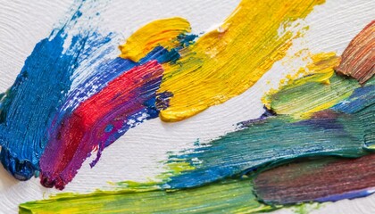 Obraz premium Close-up colourful brush strokes oil paints on white paper white background. Abstract colourful concept wallpaper