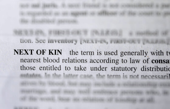close up photo of the words next of kin
