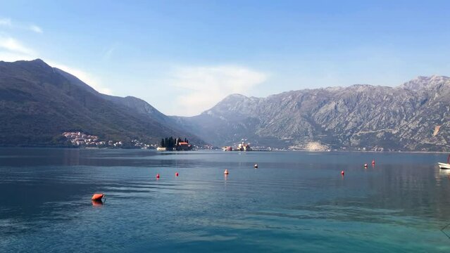 View of the islands of Saint George and Our Lady of the Rocks off the coast of the historic town of Perast. Bay of Kotor. Adriatic Sea. Perast, Montenegro. Europe.