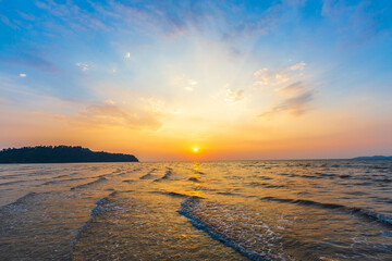 Sunset or evening time over sea water wave. with blue and orange hot sky color.