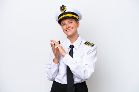 Airplane caucasian pilot woman isolated on white background applauding after presentation in a conference