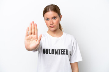 Young volunteer woman isolated on white background making stop gesture