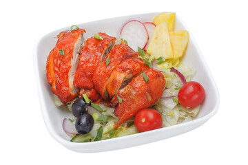 Chicken kebab in tomato sauce with vegetables on a white background