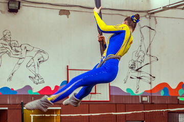 Aerial gymnast in the gym during a performance