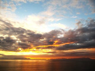 Grumpy grey clouds with a bright sunset