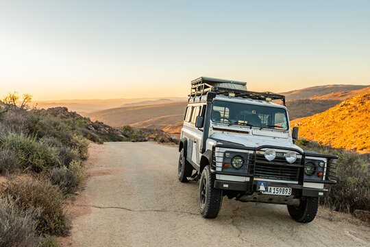 Richtersveld, South Africa - March 11, 2024: Land Rover Defender parked on a gravel road on dirt road mountain pass