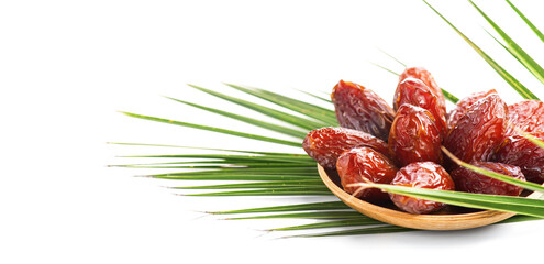 Dates fruit. Date fruits in wooden bowl with palm tree leaf isolated on white background. Organic Medjool dates close up. Vegan food.  - 778152266