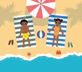 Cute little African kids in swimsuit sunbathing lying on the beach 