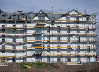 Scaffolding on the facade of a building under construction