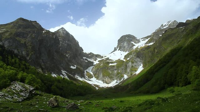 Melting snow in the mountains in spring. Artiga de Lin, in the Aran Valley, located in the Catalan Pyrenees in Spain.