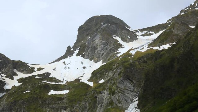 Melting snow in the mountains in spring. Artiga de Lin, in the Aran Valley, located in the Catalan Pyrenees in Spain.