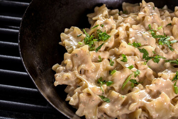 4k ultra hd image of Creamy Stroganoff in a steel pan