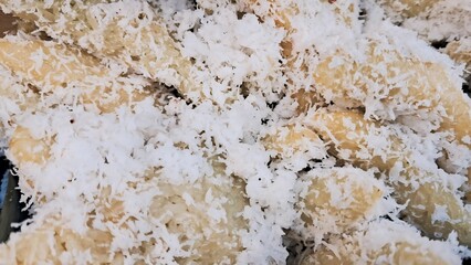 lupis cake is a traditional food made from sticky rice sprinkled with grated coconut