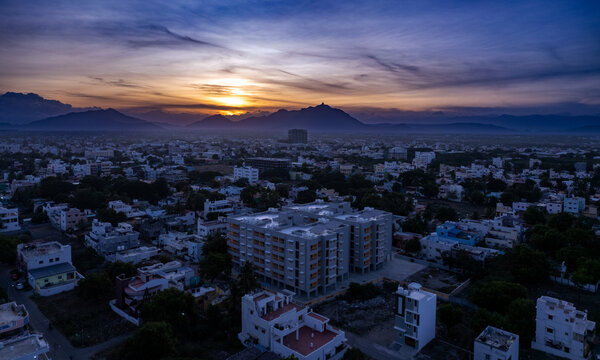 Coimbatore City with urban skyscrapers at sun set. Retro color at sunset. A big apartment in the midst of the city. Beautiful sky view