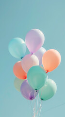 Colorful balloons on blue sky background.
