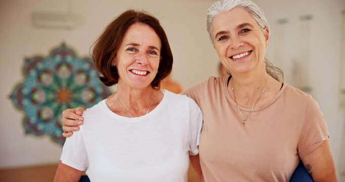 Portrait, yoga and mature woman friends in class for health, wellness and exercise with confidence. Smile, workout and happy elderly people hug in pilates studio for support, balance and body care