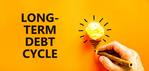 Long-term debt cycle symbol. Concept words Long-term debt cycle on beautiful orange paper....