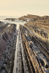 Zumaia. Euskadi. Spain. The Flysch, natural wonders of the Basque Country. A magical landscape. Layers of sedimentary rocks store data from 50 million years ago.