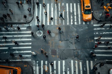 Overhead perspective of a city street filled with pedestrians and cars, showcasing the hustle and bustle of urban life