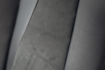 Grey alcantara texture. Close up car seat fabric material. Surface of leatherette for textured background. 